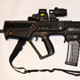 This Left Hand IWI TAVOR has it all: night vision compatible Eotech EXPS 3-0 with a twist-mount 3X Magnifier and Suppressor-ready AAC flash hider.