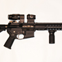 The New Barrett REC-7 Generation 2 Piston. With an Aimpoint T-1 and detachable Aimpoint 3X magnifier. It also has a Magpul Rail Vertical Grip.
